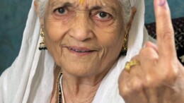 Jammu: An 83-year-old woman, Krishna Devi, shows her inked finger after casting her vote in Jammu on Tuesday, October 01, 2024. (Photo: IANS)