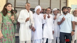 Jhajjar: Congress leader Bajrang Punia, along with his wife Sangeeta Phogat and others, shows an ink-marked finger after casting their vote during the Haryana assembly election in Jhajjar on Saturday, October 05, 2024. (Photo: IANS)