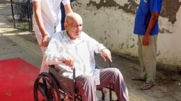 Gurugram: An elderly voter is assisted to a polling booth as he arrives in a wheelchair to cast his vote in the Haryana Assembly elections in Gurugram on Saturday, October 05, 2024. (Photo: IANS)