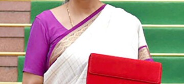 New Delhi: Union Finance Minister Nirmala Sitharaman carrying the Budget tablet poses for photos as she arrives at Parliament House to present the Union Budget 2024 in New Delhi on Tuesday July 23, 2024. (Photo: IANS/PIB)